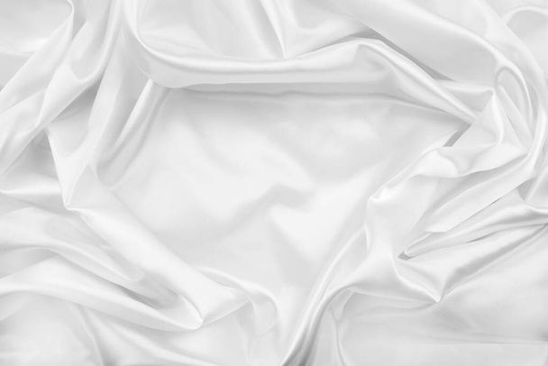 Closeup of rippled white silk fabric lines - 写真・画像