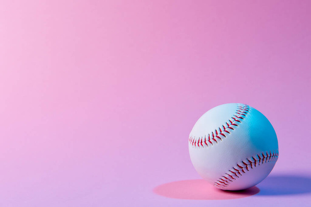 Baseball ball on pink background. Team sport concept - Zdjęcie, obraz