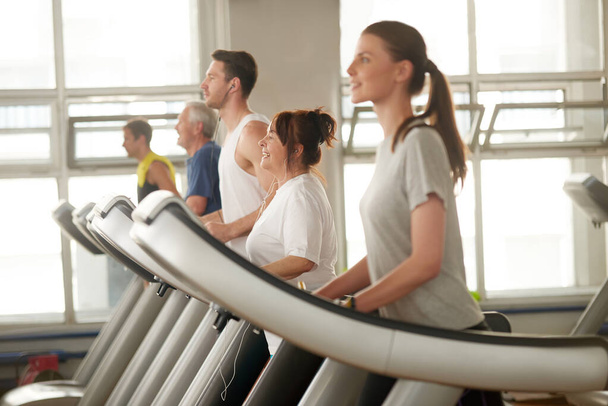 People on treadmill at gym. - Photo, Image