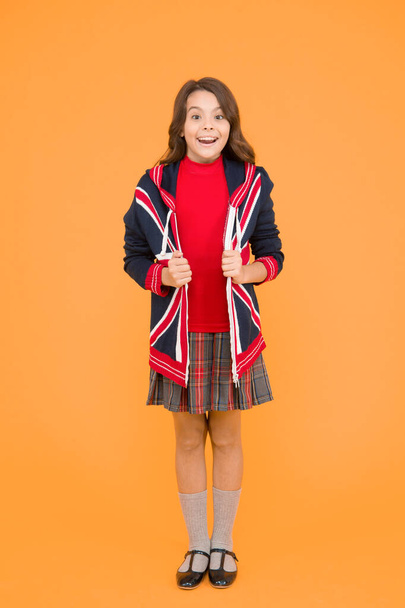 Do you speak english. go study to england. learn english language. british school in england. vacation in great britain. travel. Union Jack Flag. small girl uniform. kid with english flag on jacket - Foto, afbeelding
