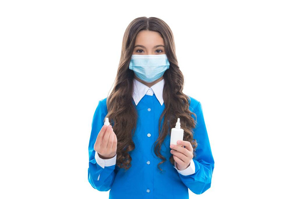 girl hold medicine nasal spray drug from running nose wearing protective medical mask isolated on white, coronavirus - Foto, imagen