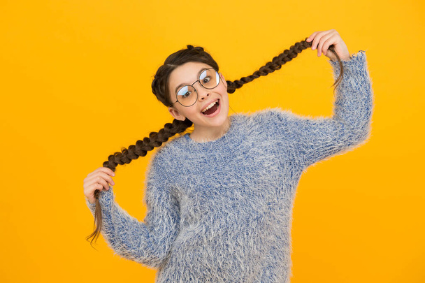 vision for your life. braided hair in pigtails. happy teen girl with stylish hairstyle. smart looking kid. beauty in glasses. childhood happiness. smiling child wear glasses because of poor eyesight - Foto, afbeelding