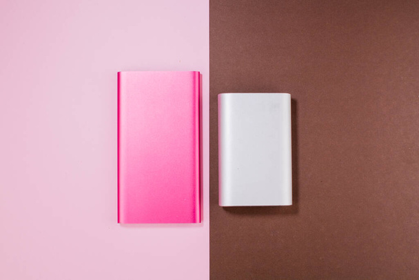 a pink and gray power bank on background - 写真・画像