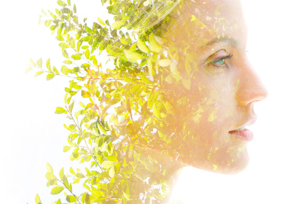 Double exposure of a beautiful womans profile on white background - Photo, Image