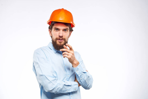 Worker man in orange paint engineer emotions industry construction - Valokuva, kuva