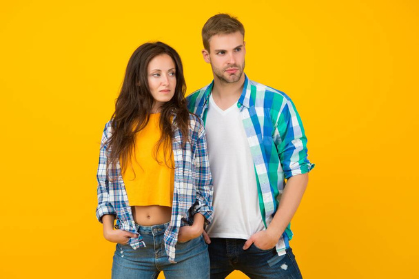 Married and in love. Family couple yellow background. Young wife and husband in casual style. Family values. Romantic relationship. Trust and care - Photo, Image