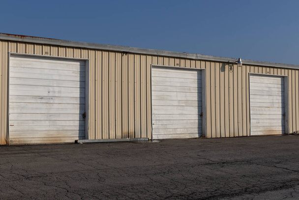 Self storage and mini storage garage units deserted, cold, and abandoned. - Photo, Image