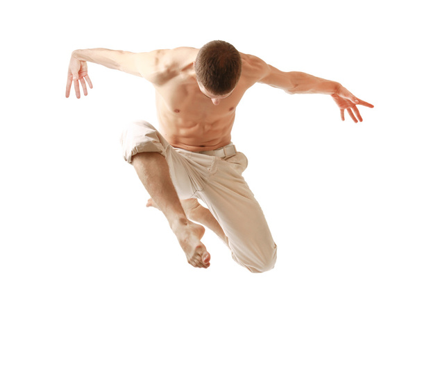 Young man jumping high - Foto, afbeelding