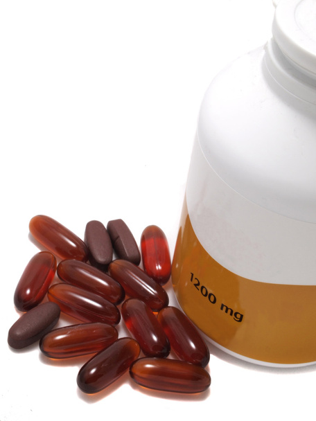 Gel and Vitamin capsules with White pill bottle. - Photo, Image