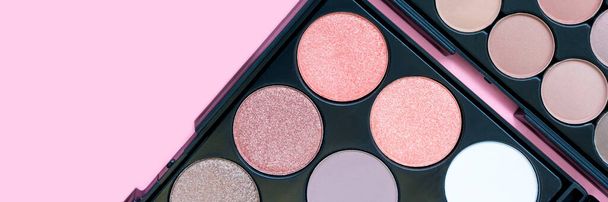 Beautiful colorful eyeshadow palette. Make-up. Beauty banner. Decorative cosmetics. Tool for makeup artist. Brown eye shadow. Flat lay. Closeup. Pastel trendy colors. Copy space. Place for text. - Foto, Imagem