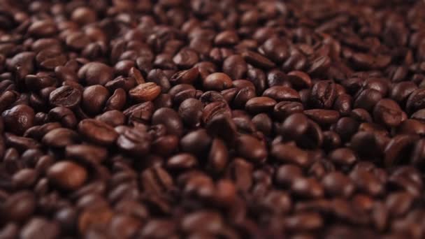 Coffee beans. Closeup rotation and fall. Dark seeds for an aromatic drink - Video