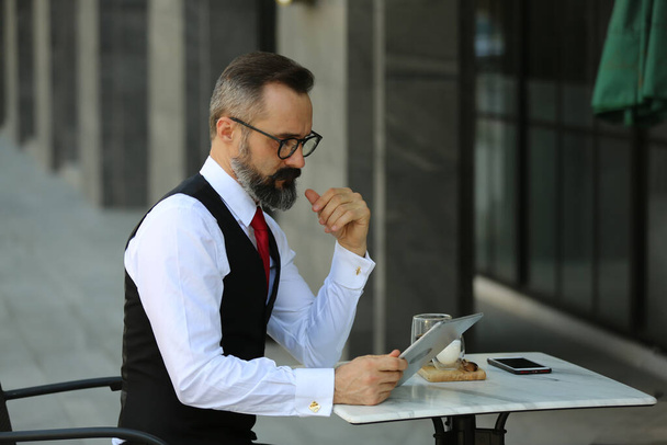 Bearded hipster businessman or Businessman hipster with stylish beard portraits. - Photo, Image