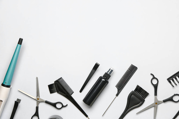 Set of hairdresser's tools on grey background - Foto, Imagen