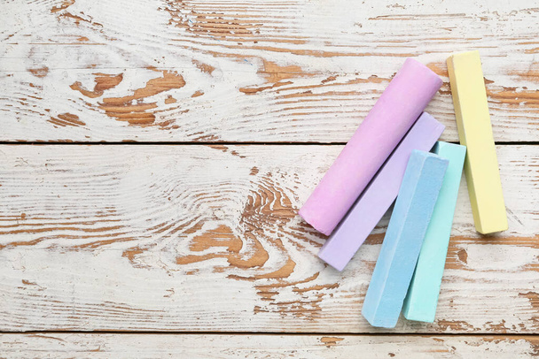 Colorful chalks on wooden background - Photo, Image