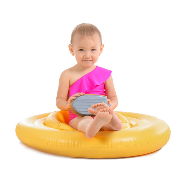 Cute baby girl with inflatable ring on white background - Photo, Image