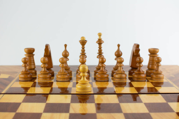 a first step white chess wooden piece - Fotoğraf, Görsel