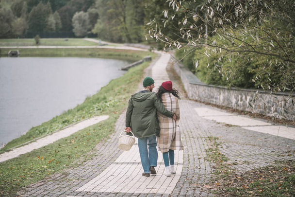 Man and woman having a date near the river - Fotó, kép