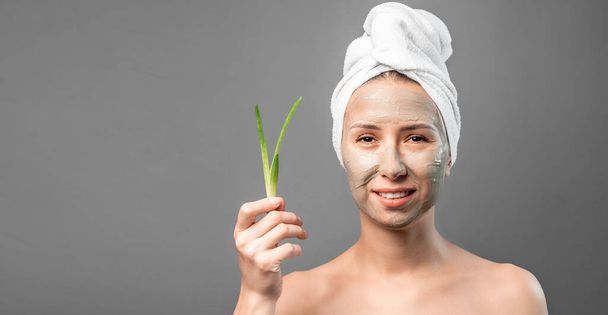 Beautiful young woman with facial mask aloe vera extract, Skincare, cleansing, organic cosmetic. Beauty SPA procedures. - Photo, Image