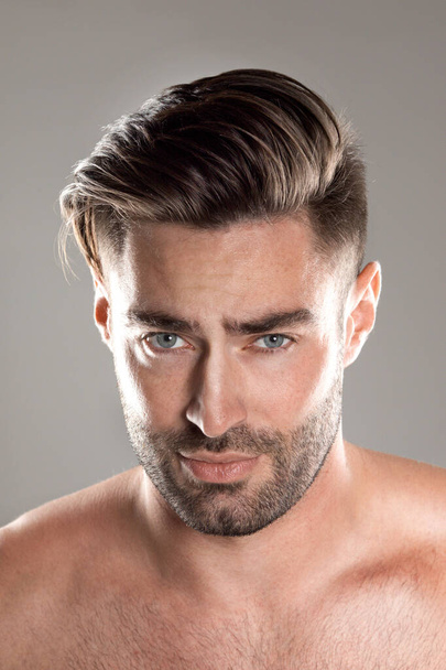 Closeup portrait of a beautiful male model, caucasian man with dark hair and gray eyes - Photo, image