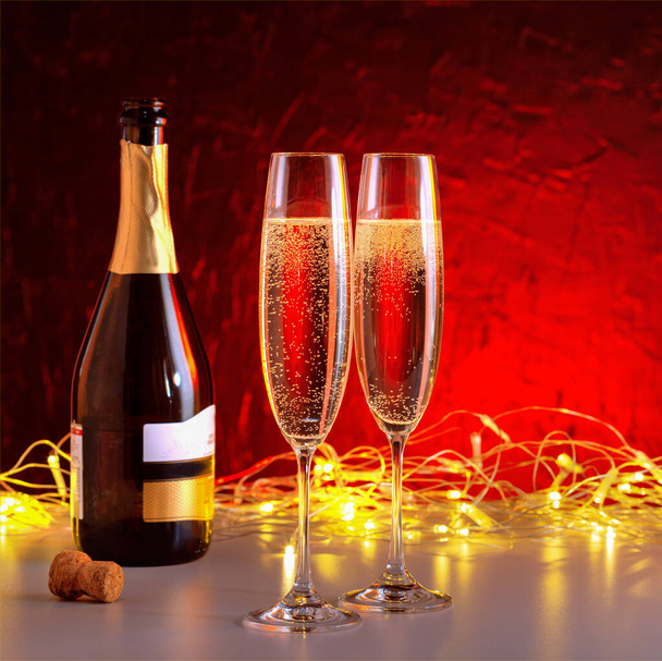New year champagne glass and golden illumination. - Zdjęcie, obraz