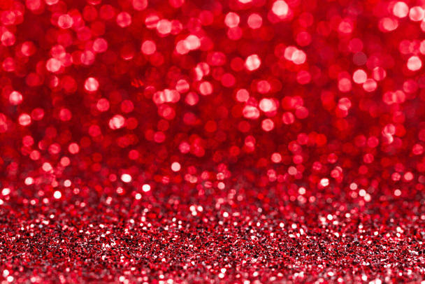 Shiny red bokeh glitter lights abstract background, Christmas New Year Valentines day party celebration concept - Photo, image