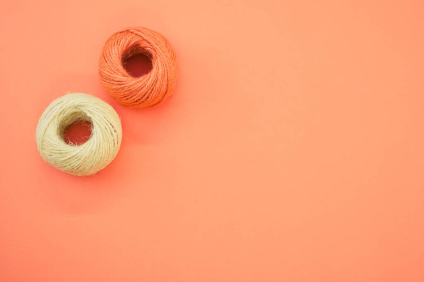 The yarn balls for knitting isolated on orange background - 写真・画像