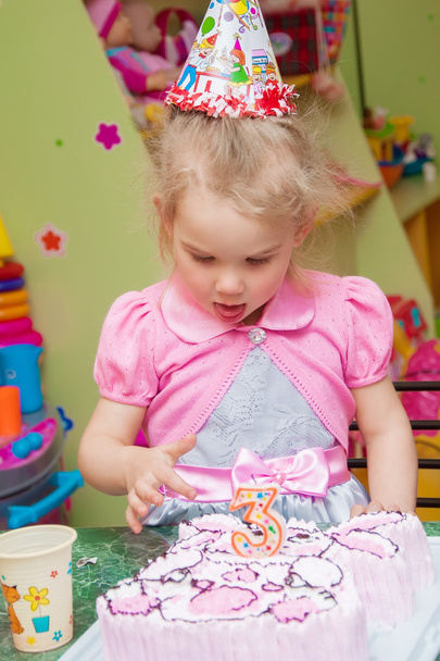 Little girl with birthday cake on birthday party - Photo, image