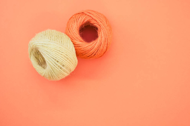 The yarn balls for knitting isolated on orange background - Photo, image