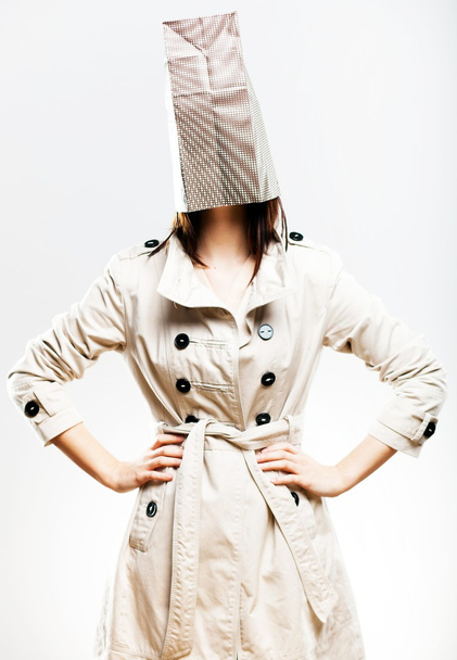 Consumerism fashionable woman with shopping bag on head - Zdjęcie, obraz