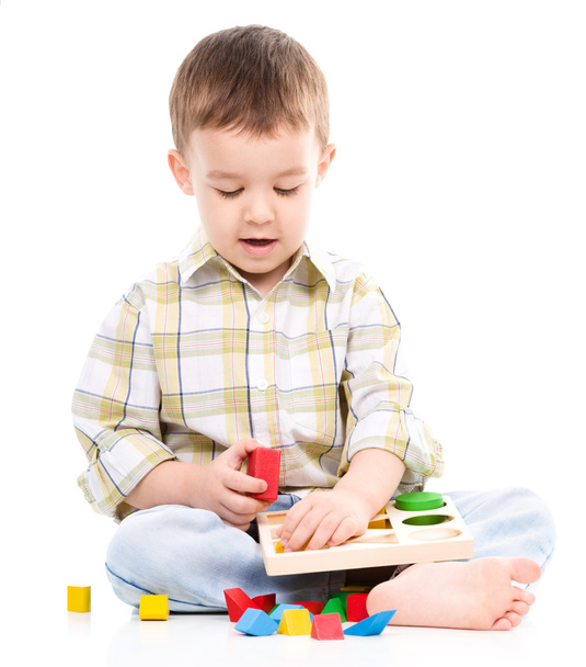 Little boy is playing with toys - Photo, Image