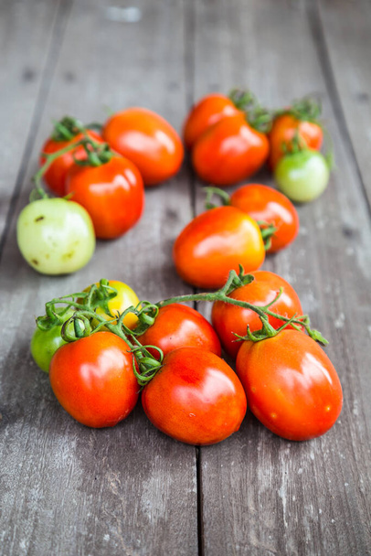 tomatoes on wooden background  - Photo, Image