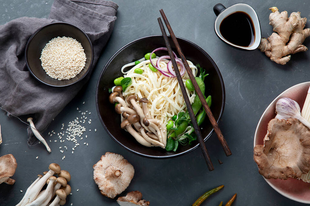 Udon noodles with mushroom and vegetables. Asian style healthy food. Top view - Foto, Imagem