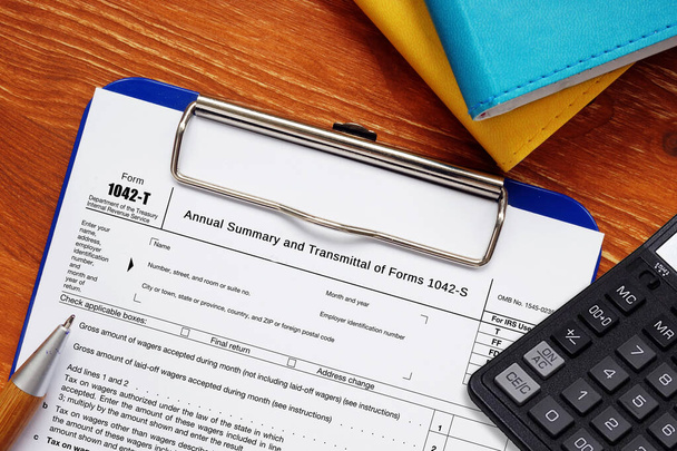 Business concept meaning Form 1042-T Annual Summary and Transmittal of Forms 1042-S with sign on the sheet - Photo, Image