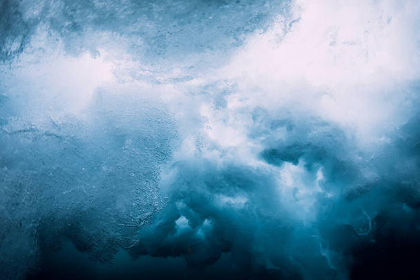 Underwater ocean wave with foam and bubbles. Transparent water and breaking wave - Photo, Image
