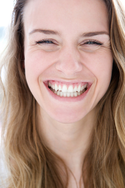 Woman laughing with joy - Φωτογραφία, εικόνα