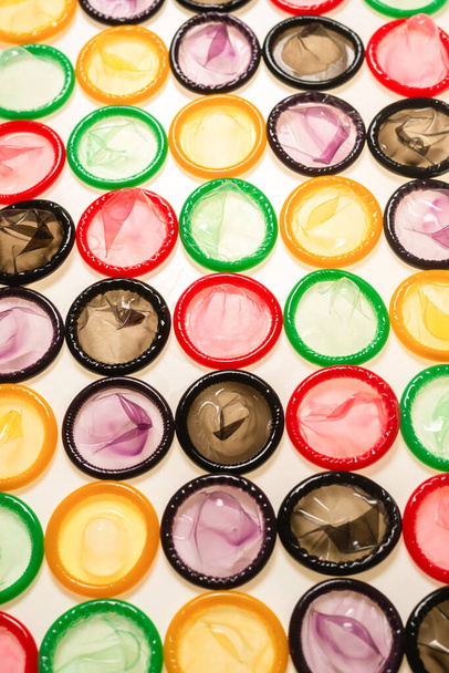 Colorful condoms background. Top view.  - 写真・画像