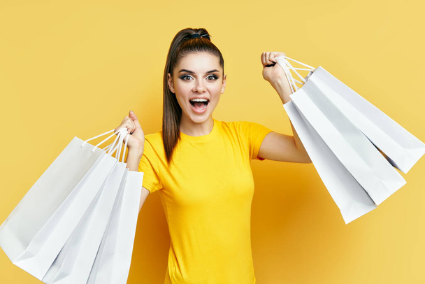 Happy excited shopaholic woman with shopping bags in hands enjoy her shopping - Фото, зображення