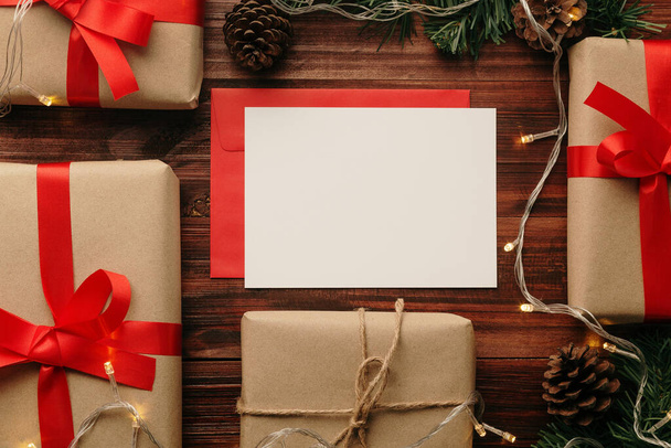 Merry christmas greeting card and envelope mockup template with christmas gifts decorations. - Photo, Image