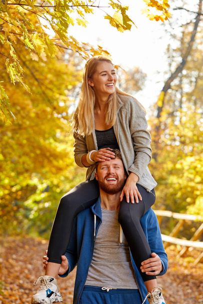 lovely caucasian couple enjoy the walk in the forest - Photo, Image