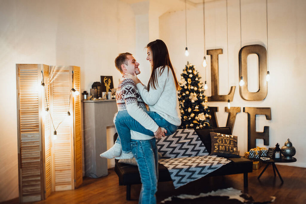 a guy and a girl celebrate the new year togethe - Фото, изображение