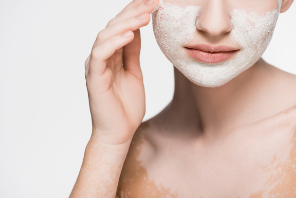 cropped view of woman with vitiligo and clay mask on face isolated on white - Φωτογραφία, εικόνα