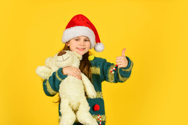 Simple happiness. Christmas gift. Teddy bear improve psychological well being. Kid little girl play toy teddy bear. Happy childhood. Toys shop. Cute plush friend. Small girl hold teddy bear toy - Zdjęcie, obraz