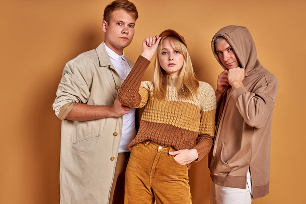 photogenic group of young people posing in stylish cozy outfit, studio shoot - Foto, immagini
