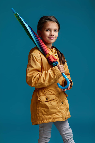 cute child girl with multicolored umbrella - Foto, Bild
