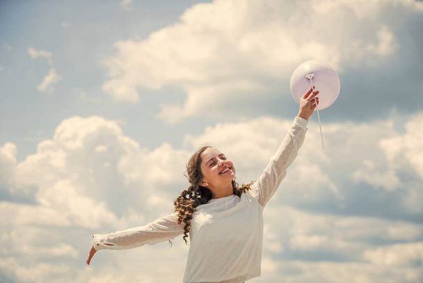 holiday objects. Happy child with colorful air balloons over blue sky background. express positive emotions. just have fun. freedom. summer holidays celebration. international childrens day - Φωτογραφία, εικόνα