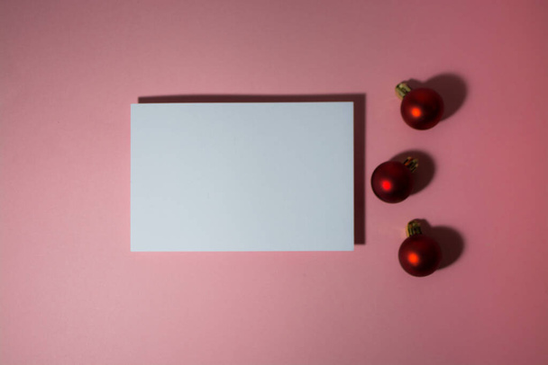 Christmas greeting card or photo frame over red background. - Zdjęcie, obraz