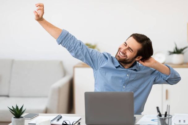 Man Massaging Aching Neck After Work At Computer In Office - Photo, Image