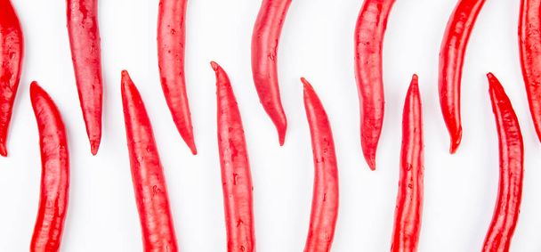 Red hot chili peppers over white background. Vitamin vegetable food - Foto, afbeelding