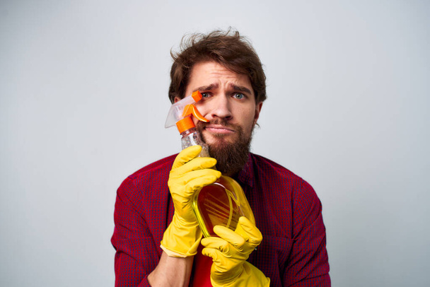 Man in yellow rubber gloves detergent housework rendering  - Photo, image