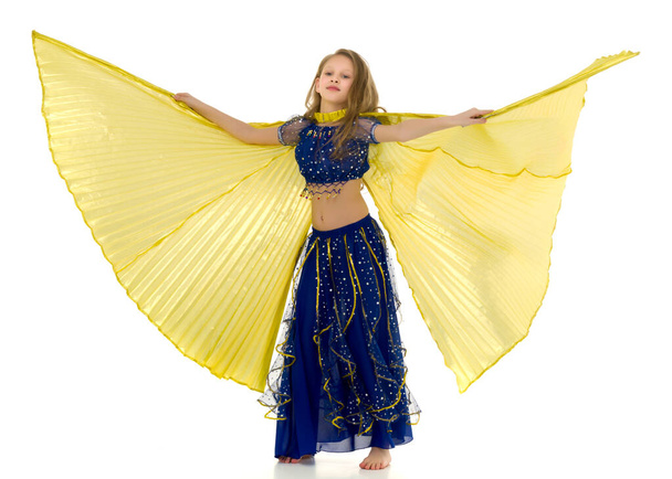 Blonde Girl in Oriental Costume Dancing Belly Dance with Wings - Photo, Image